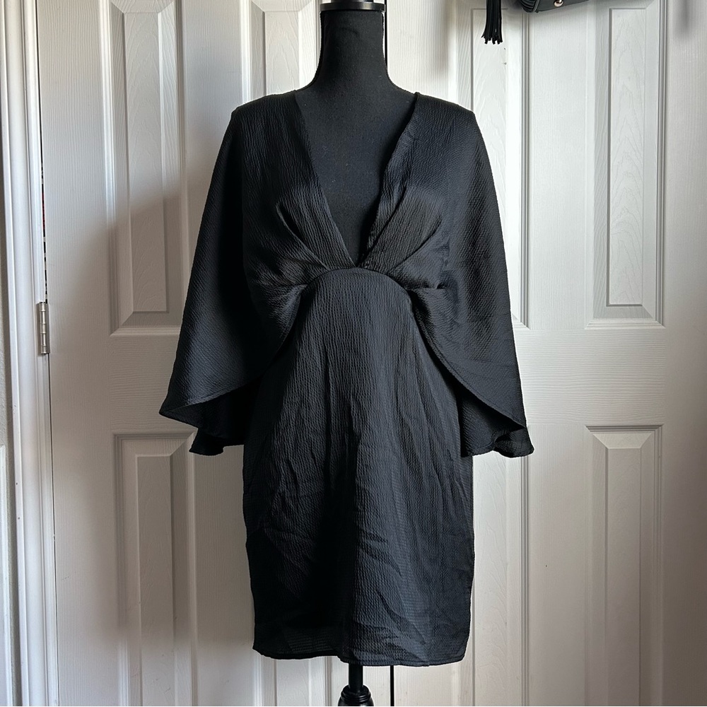 Vici black low cut mini dress with attached cape